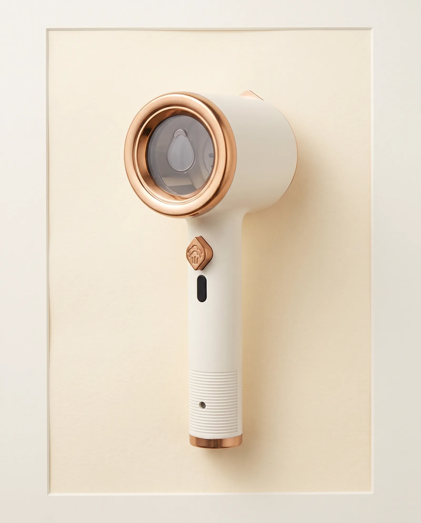 Mini Portable Handheld Garment Steamer photographed as a specimen on the mat